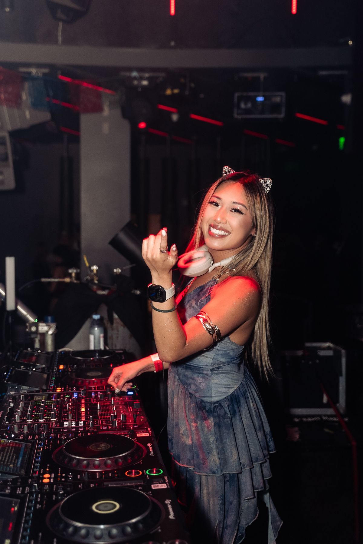 Seduza in the DJ booth wearing cat ears